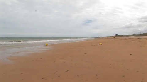 Windsurfer coming to shore on Juno Beach, Normandy France Stock Footage 102350005