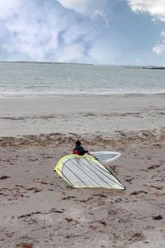 Windsurfer getting board ready to surf Stock Photos