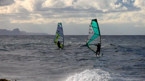 Windsurfer having fun on the sea during a windy day. Video stock 88342904