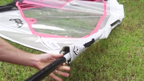 Windsurfer inserts mast into sail. Close up shot. Maui Hawaii Stock Footage 136265470