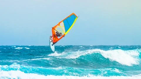 Windsurfer jump on the waves Stock Photos