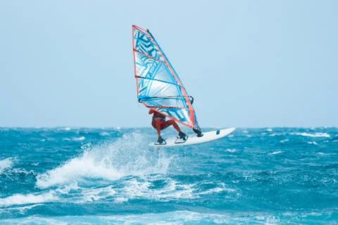 Windsurfer jumping on the waves Stock Photos