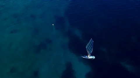 Windsurfer learning how to swim on the board. Croatia, Adriatic sea Stock-Footage 55253786