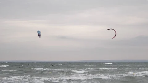 Windsurfer with parachute sail the wind and glide the waves. Stock Footage 100144377