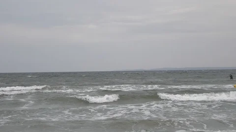 Windsurfer with parachute sail the wind and glide the waves. Stock Footage 100146302