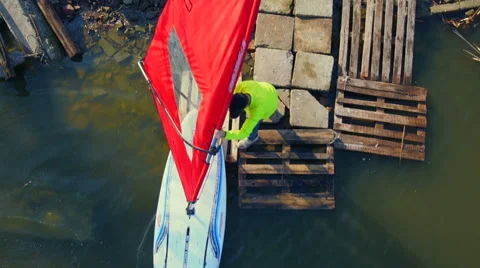 Windsurfer preparing for sailing on lake aerial shot top view Stock Footage 47526253