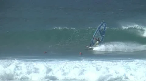 Windsurfer riding a wave at Hookipa Maui Stock Footage 10686928