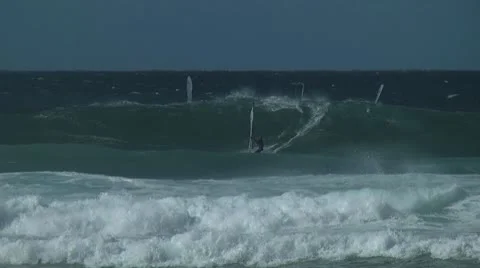 Windsurfer riding a wave at Hookipa Maui, Hawaii Stock Footage 10699175