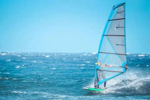 Windsurfer riding the wave Stock Photos