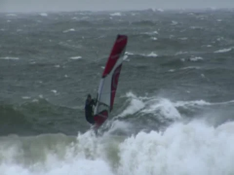 Windsurfer riding Wave in Winter - Baltic Sea Stock Footage 10767799