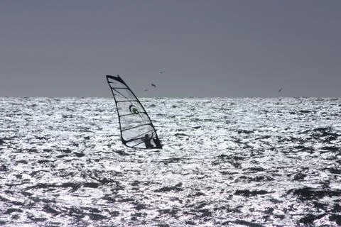 Windsurfer silhouette Stock Photos