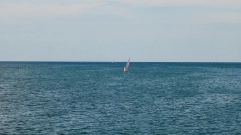 Windsurfer swims in the sea. Stock Footage 115504814