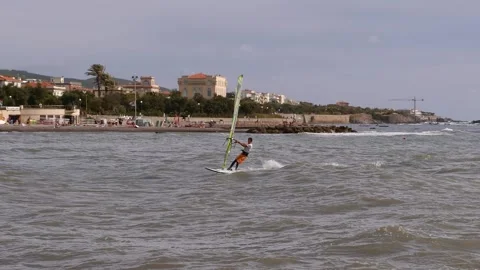 Windsurfer who Reverses the Direction of Movement between the Waves Stock Footage 138933211