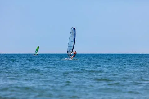 Windsurfer with windsurf on sea waves Foto stock