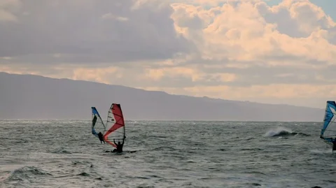 Windsurfers having fun on the sea during a windy day. Stock Footage 88342899
