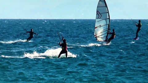 Windsurfers sailing along the beach of Tarifa town Stock Footage 108325342