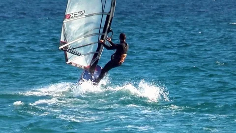 Windsurfers sailing along the beach of Tarifa town Stock Footage 108325554