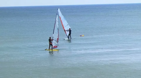 Windsurfers in the sea Stockbeeldmateriaal 7737719