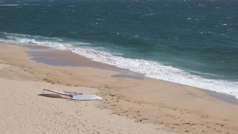 Windsurfing board lying on sandy beach in Portugal Video stock 132228129