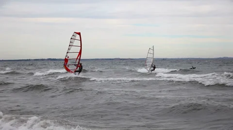 Windsurfing on a cloudy day Stock Footage 29524725