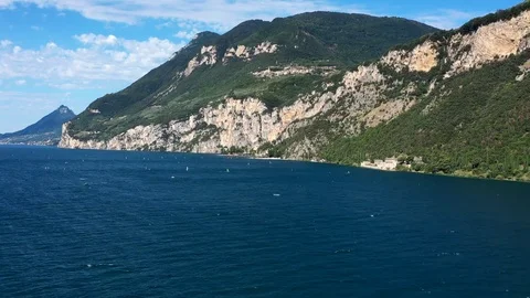 Windsurfing sails on blue water in the background cliffs Stock Footage 113667049
