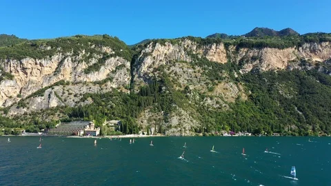 Windsurfing sails on blue water in the background cliffs Stock Footage 113667295