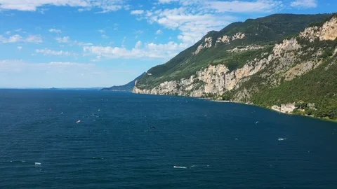 Windsurfing sails on blue water in the background cliffs Stock Footage 113667434