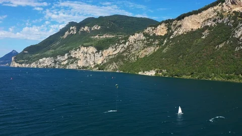 Windsurfing sails on blue water in the background cliffs Stock Footage 113667543