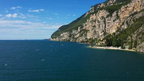 Windsurfing sails on blue water in the background cliffs Stock Footage 113667885