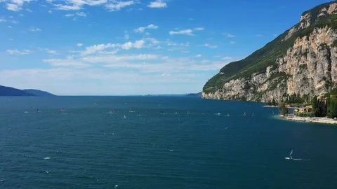 Windsurfing sails on blue water in the background cliffs Stock Footage 113667886