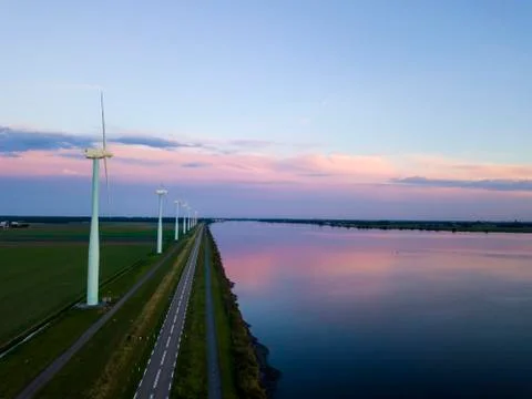 Windturbine with a sunset Stock Photos