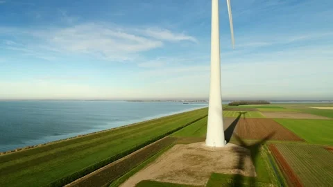 Windturbine throwing shadows in the Netherlands Stock Footage 289955877