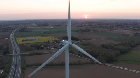 Windturbine working in field during sunset in europe Video stock 122958254