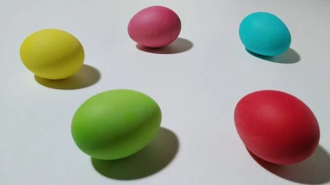 Windup mechanical chick hops between easter eggs 2 Stock Footage 104923533