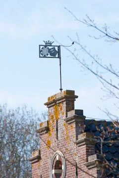Windvane on hiostoric brick wall Stock Photos
