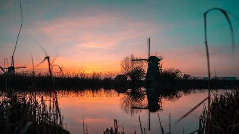 Windwill at sunset in The Netherlands. Stock Photos