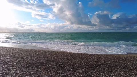 Windy and cloudy day: rough waves and pebble shore sound, Antalya Video stock 323493227