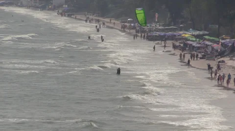 Windy and cloudy resort beach, muddy water. Thailand, Hua Hin. Stock Footage 34509176