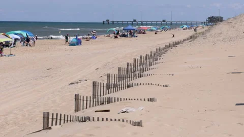Windy beach at Nags Head on NC outer banks-view to pier Video stock 202327408