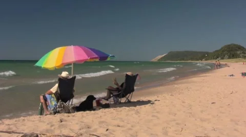 Windy beach with umbrella Stock Footage 972146