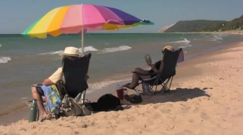 Windy beach with umbrella Stock Footage 972186