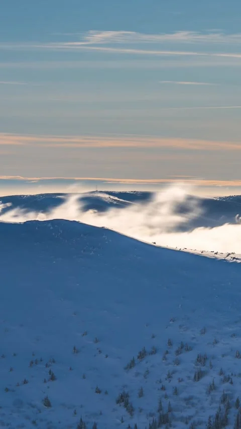 Windy Day in Winter Mountains, Vertical Time Lapse of Clouds and Snow Stock Footage 312888435