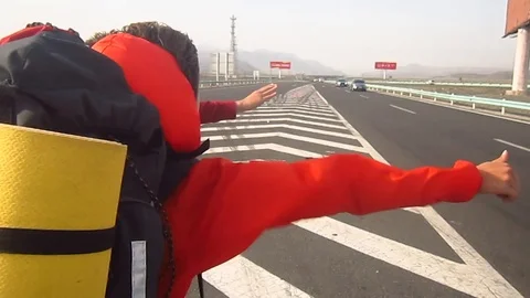 Windy Hitchhiking Stock-Footage 104232223
