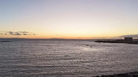 Windy Hyperlapse of Red Sunset Over Ruby Bay, Fife 1 Stock Footage 326973006