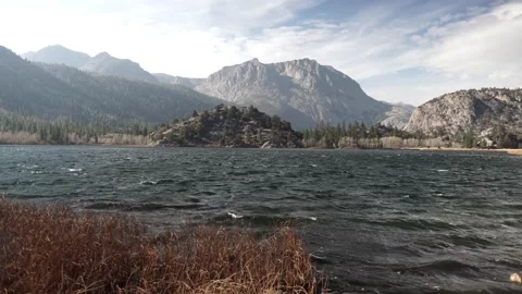 Windy Lake with Waves and Mountains on the Horizon, Yosemite, Gimbal Shot Stock Footage 145470426