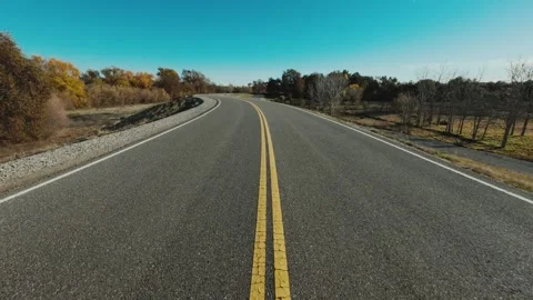 Windy levee road with solid yellow line Stock-Footage 295006892