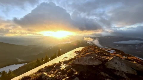 Windy mountain landscape in winter, Hill ridge covered with snow and grass Video stock 261554835