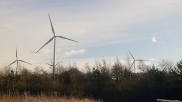 Windy turbine spinning on a cloudy windy day, renewable green energy  Stock Footage 85774186