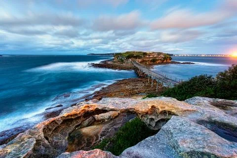 Windy views of the bridge across to Bare Island La Perouse Stock Photos