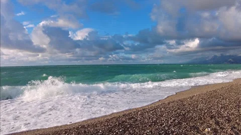 Windy waves on the pebble beach of Konyaalti, Antalya, Turkey Video stock 323556715